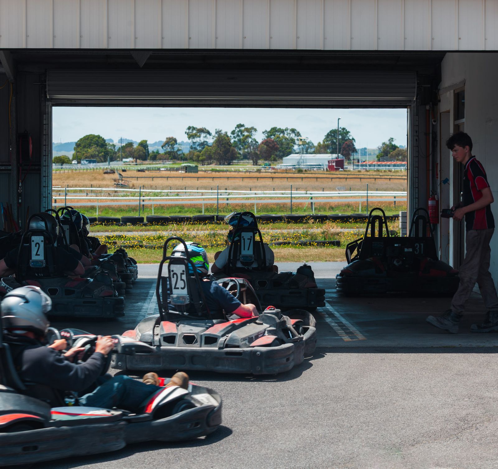 Hire karts heading out of the kart shed onto the track